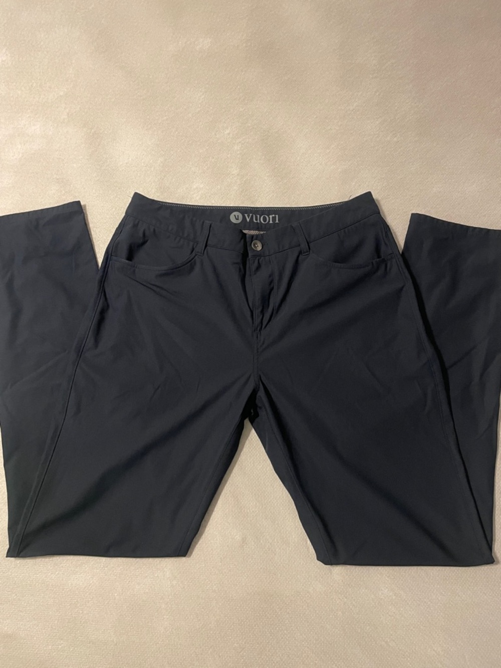 Vuori Men's Navy Performance straight leg pant.